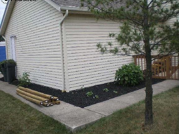 Concrete side walk to backyard