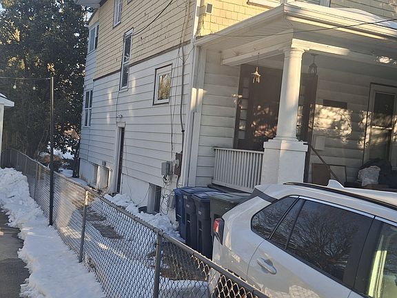 Side entrance to basement apt in single-family home (with off-street parking)