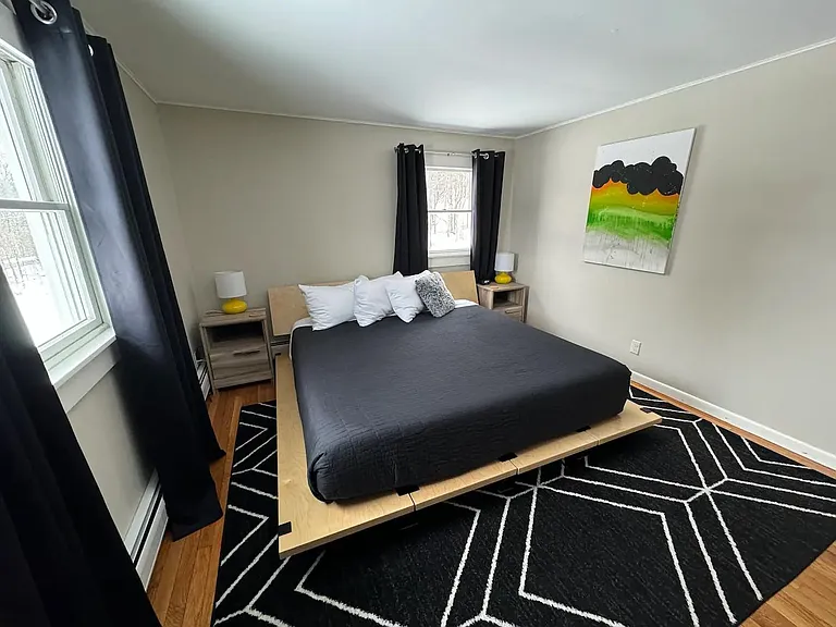 Main floor bedroom shown with king bed.
