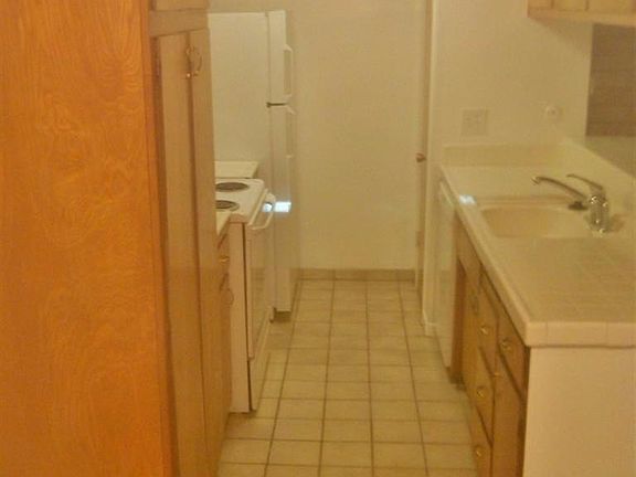 Updated kitchen with tile floor and counter.