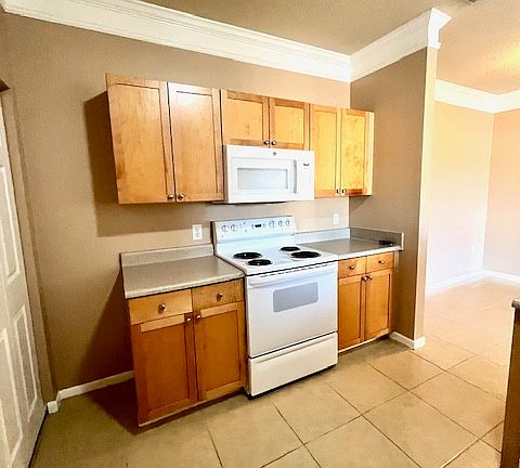 Lots of storage next to the stove and microwave
