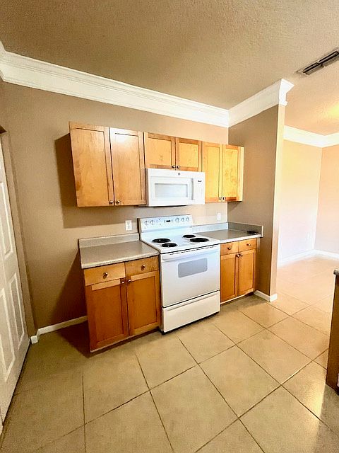 Lots of storage next to the stove and microwave
