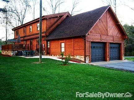 REAR VIEW & OPPOSITE END VIEW
						:
						FULL DORMER ACROSS REAR. DECK W/RAILS & CONCRETE PATIO. BEAUTIFUL VIEW FROM REAR