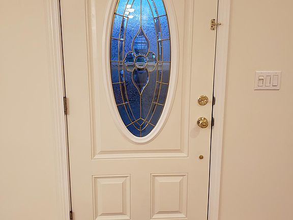Enter to large open floor plan dining room to the right, to the left living room with cathedral ceiling and lots of windows for light and airy feel.