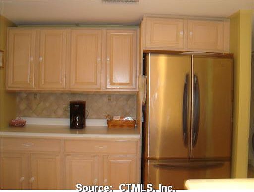 More cabinets and counter space! newer French Door Styled Stainless Steel Fridge!