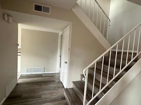 Leading to the Kitchen on the Left and Bedroom with Full Bathroom on the Right.