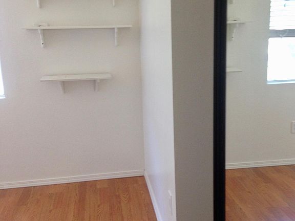 Bedroom with mirror closet doors