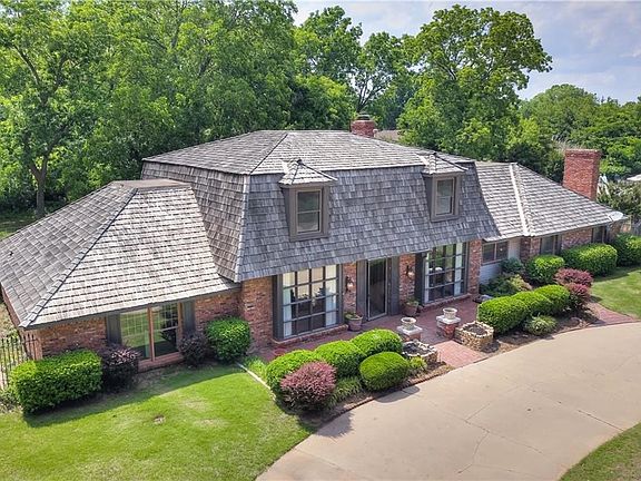 One of the drone shots that gives you a great and different view of this fantastic home.  The large circle drive is super for guests parking.  There is plenty of room on the private, fenced-in driveway for your family vehicles.