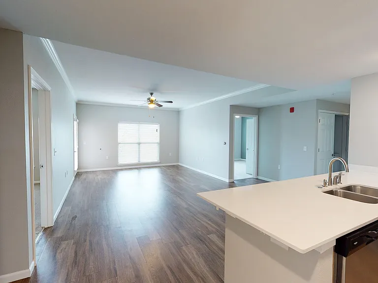 The 3-bed apartment includes an open-concept layout with the primary en suite on one side of the living space and the other bedrooms on the other. The 3-bed apartment includes an open-concept layout with the primary en suite on one side of the living spac