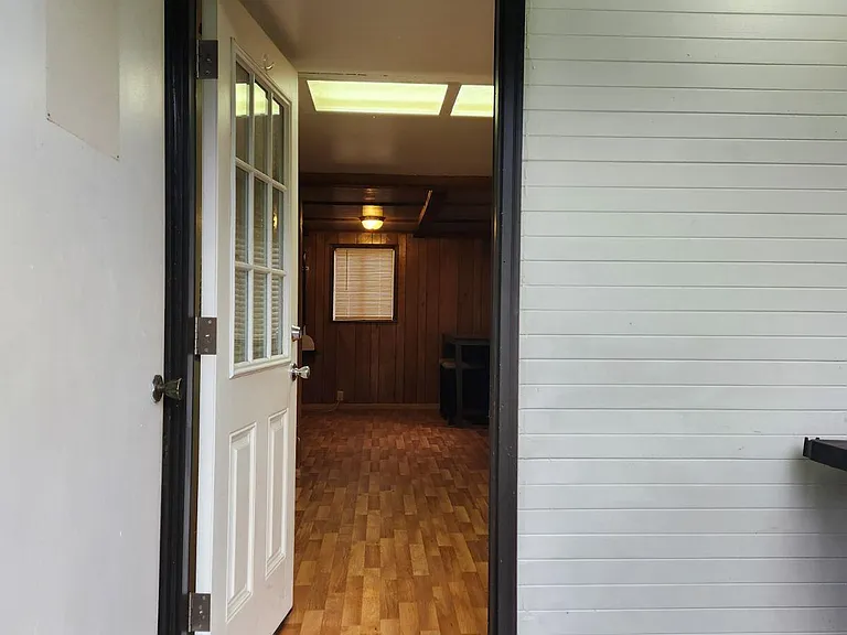 KITCHEN ENTRANCE FROM DRIVEWAY & BIG PRIVATE SIDE YARD.