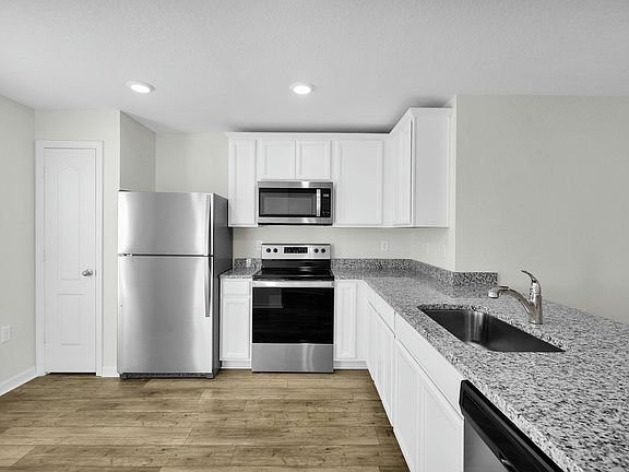The kitchen comes chef ready with stainless steel appliances