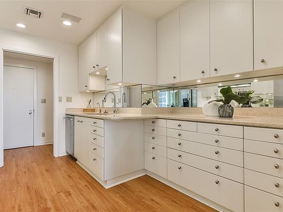 Updated kitchen features granite counter top and is dressed