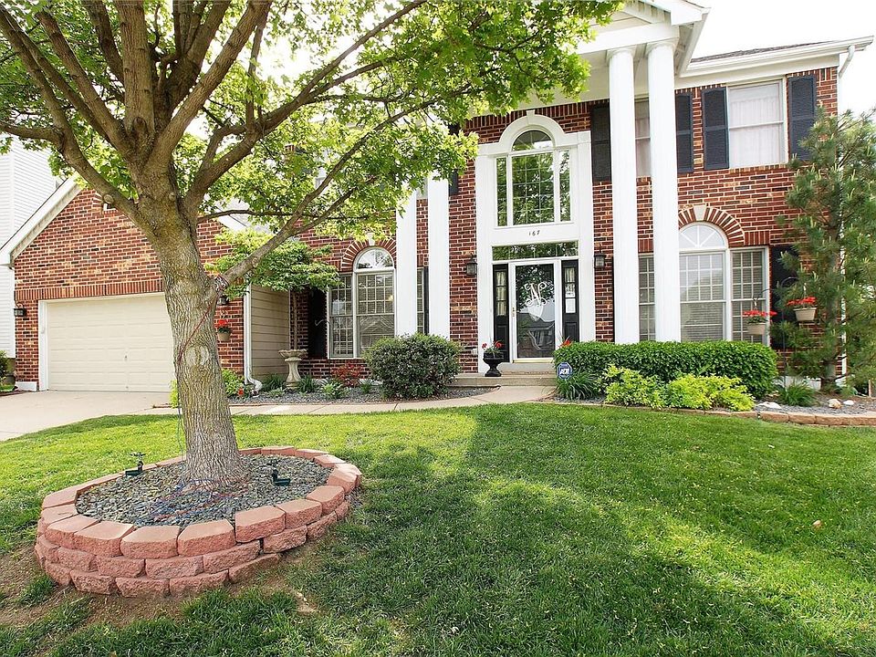 Welcome to 167 Cherry Hills Meadows Drive on a lovely cul de sac lot backing to trees