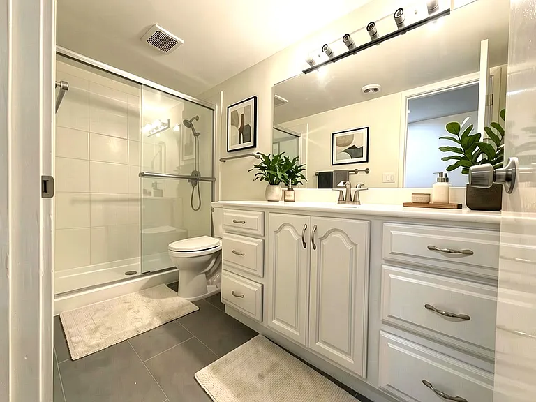 Digitally staged primary bathroom.
