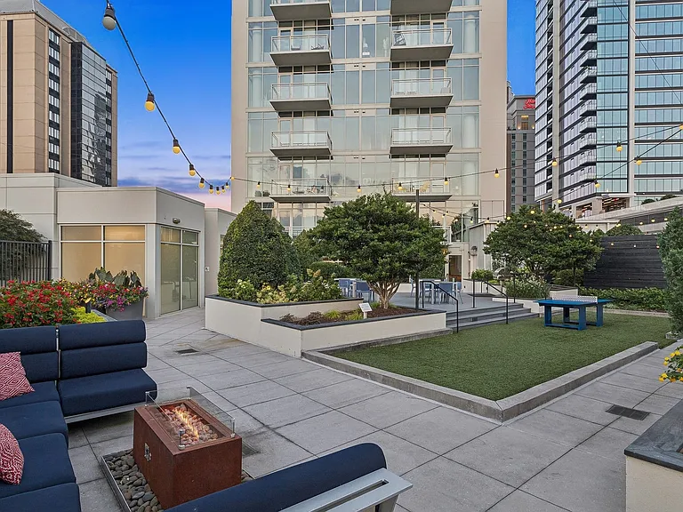 Rooftop gaming area, lounge seating, and 2 outdoor kitchens