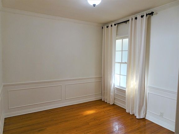 Dining area with beautiful wainscoting wood.