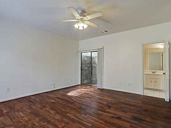 Master bedroom that offers a small paito area, great closets and nice flooring. You also have natural light for the windows.