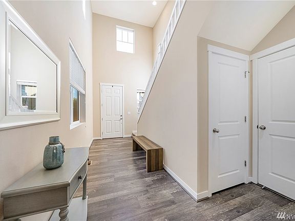 Entryway showing storage closet and garage entry to the right.