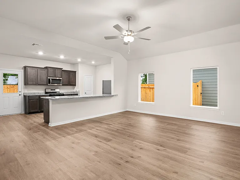 The large living room sits right off of the kitchen and dining room.