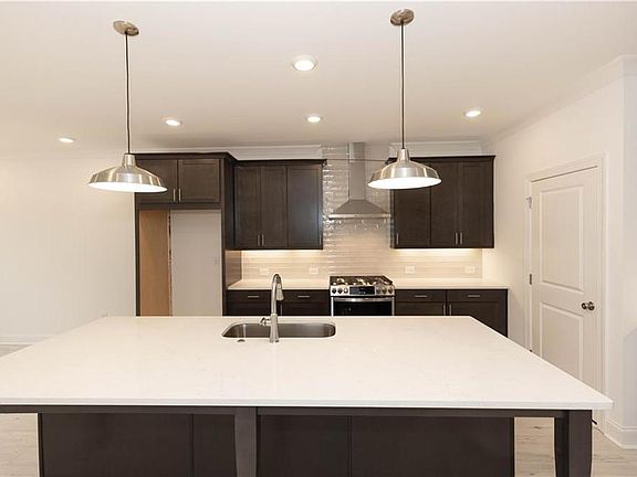 The oversized island provides ample space for dinner prep.