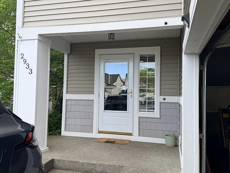 Front porch. 2 car driveway and garage.