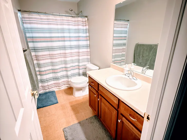 Second and Third bedrooms' bath with tiled flooring.