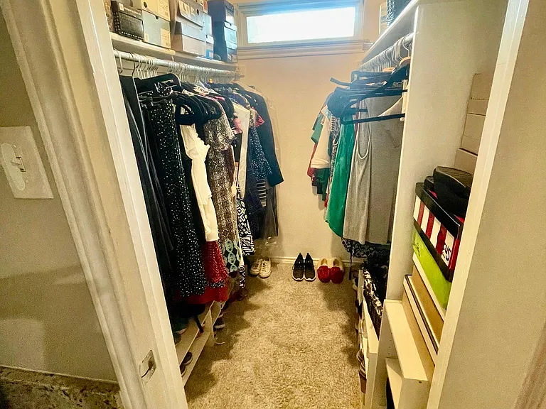 Huge walk-in closet adjacent to bathroom vanity (1 of 2 closets!)