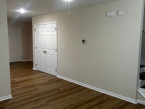 view from living room towards kitchen and laundry closet