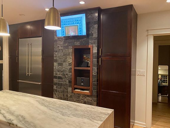 Fridge, pantry wall and TV