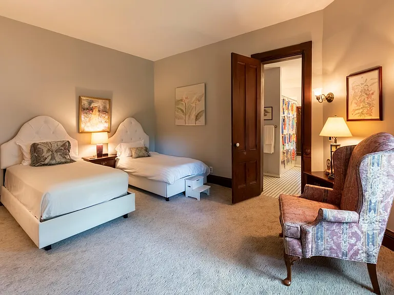 Bedroom with 2 single beds, and private bath.