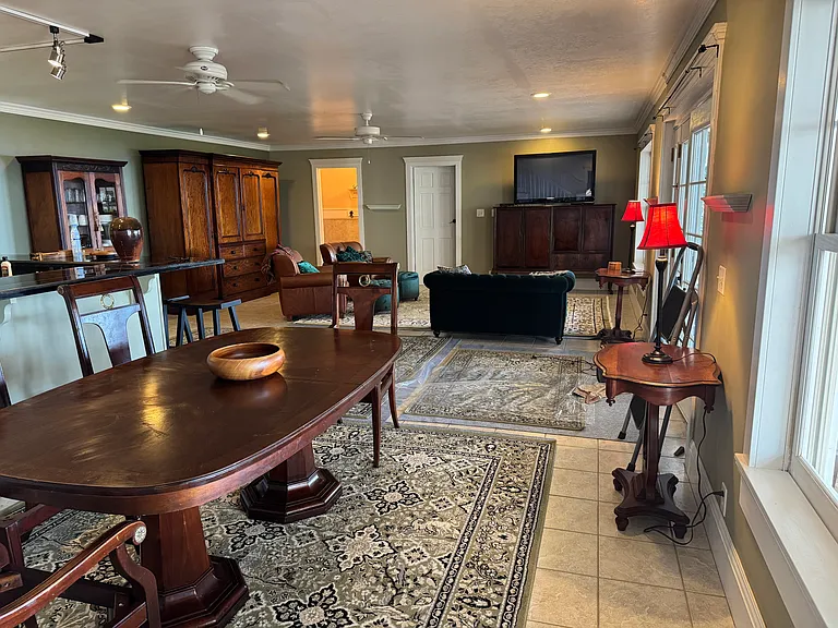 View from entrance to Kaena Bedroom en suite across the main living room to the Ewa en suite. This provides privacy for each room while still there is the guest bathroom separate from the private areas (see lighted doorway left across).