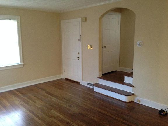 Entry to living room, hall closet, stairs to bedrooms