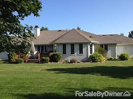 Rear of Home
						:
						The sunroom/formal dining extends into the yard for light on all sides.