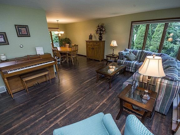 A view from the front door.  The living room (13x9) features delightful views of the both the front and back yards as well as beautiful laminate floors which were installed less than three years ago.