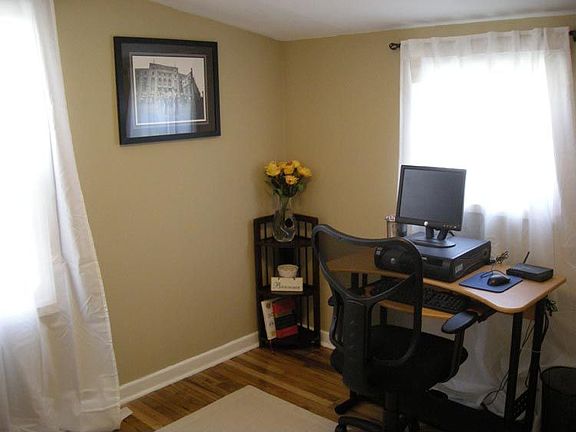 Office with hardwood floors. Could easily be a 2nd bedroom.