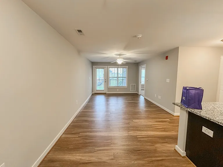 The open-concept floorplan provides for a spacious kitchen, dining room, and living space.