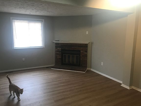 Corner wood burning fireplace.
