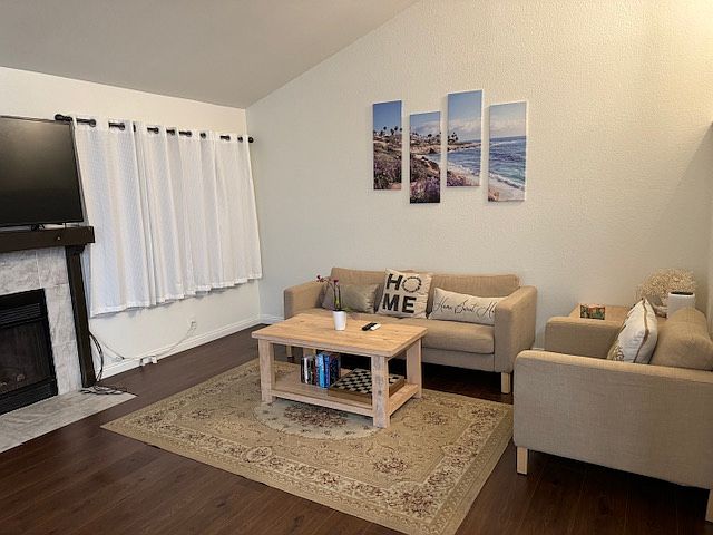 Downstairs living room. Fully equipped with sofa, coffee table, and TV.