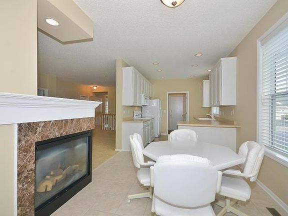 Dining Area looks into living Room and Kitchen