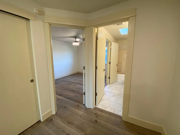 Top of stairs looking into Master Bedroom & Upstairs bathroom