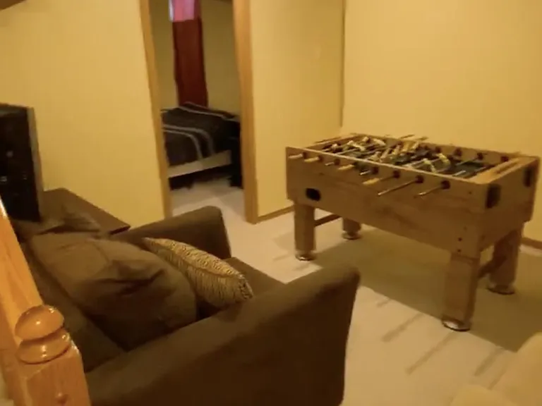 basement with lounge area and playroom