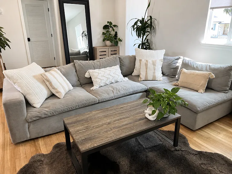 Living Room: Comfortable sectional perfect for relaxing with plenty of seating
