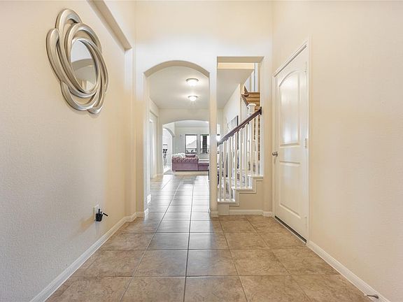 Let the memories begin. Open foyer with tile floors, archway and a peak at your staircase.
