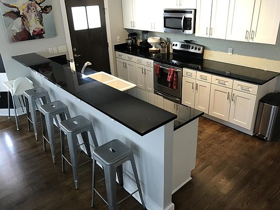 Granite, farm sink, SS appliances. Dishwasher included.