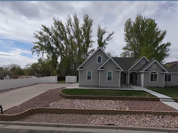 View of parking. Entrance to apartment is on the left side of home next to driveway