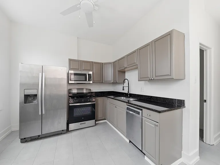 Kitchen, view of bathroom entry on right.