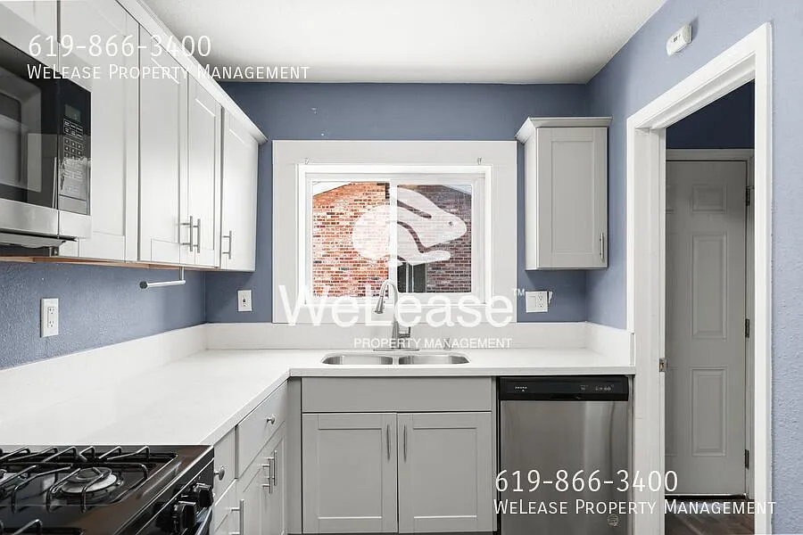 Spacious gated house featuring 4-bedrooms and 2-bathrooms- $500 off First Months Rent — Photo 2