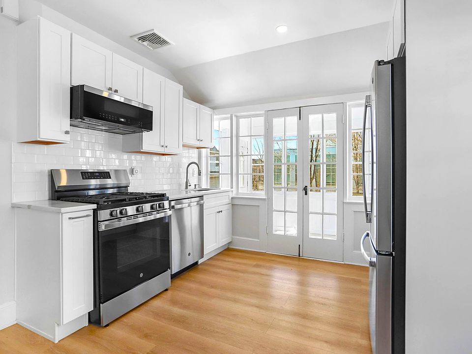 Kitchen that opens to a beautiful sunroom