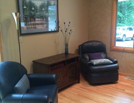 This area is just off the kitchen and is a cozy sitting space now but can also accommodate a nice-sized dining table for your family