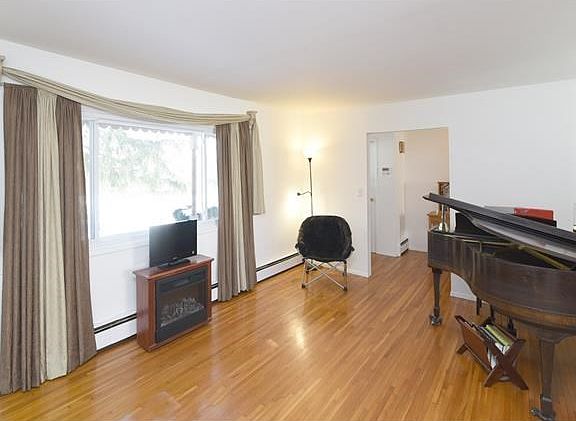 Sun filled living room with picture window.